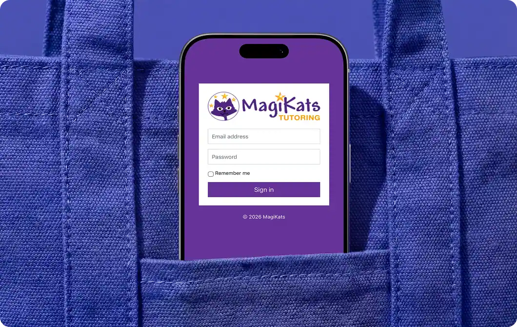 MagiKats website displayed on a smartphone in a school uniform pocket