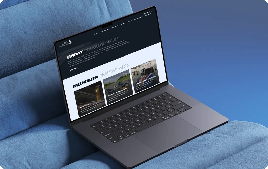 News and content for SMMT displayed on a laptop with dark theme and article grid