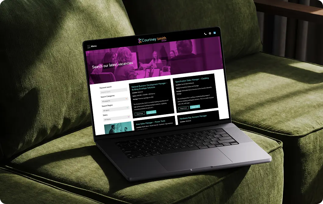 Recruitment Website homepage displayed on a laptop with purple and magenta branding
