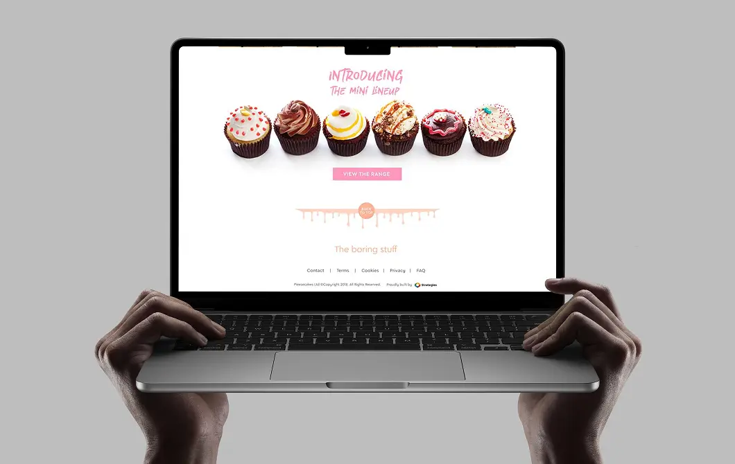 Cupcake business website homepage displayed on a laptop screen