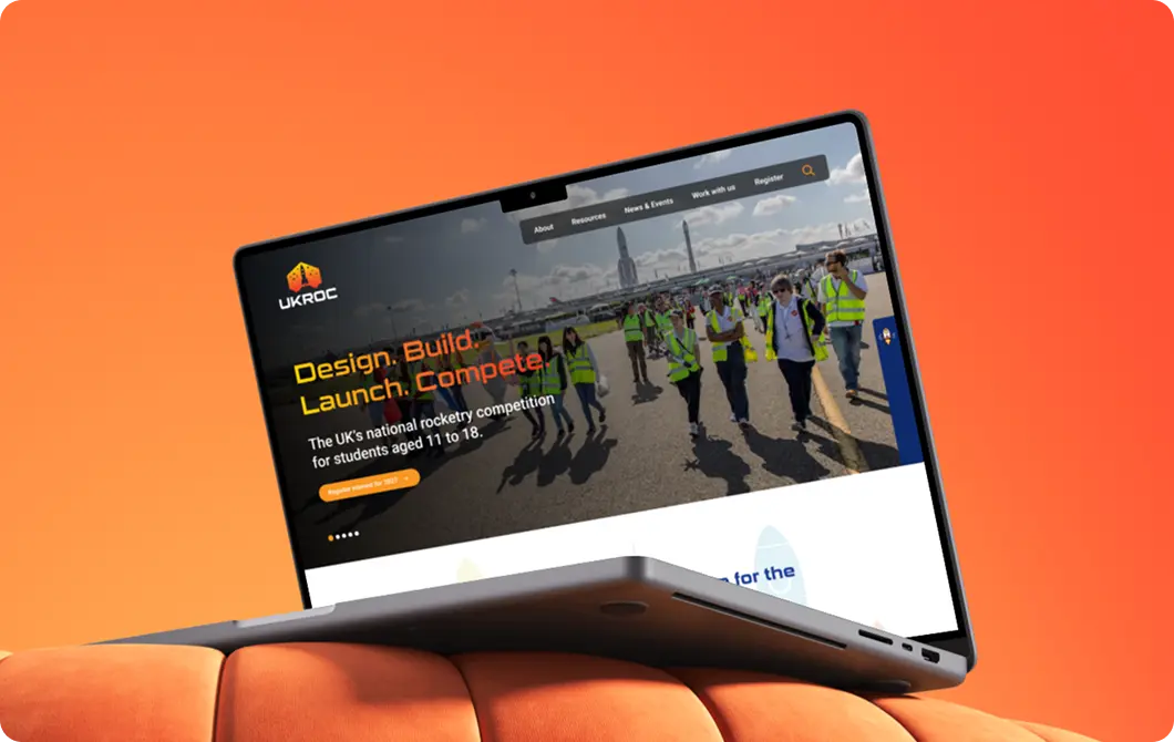 Construction and engineering website displayed on a laptop with site team photography